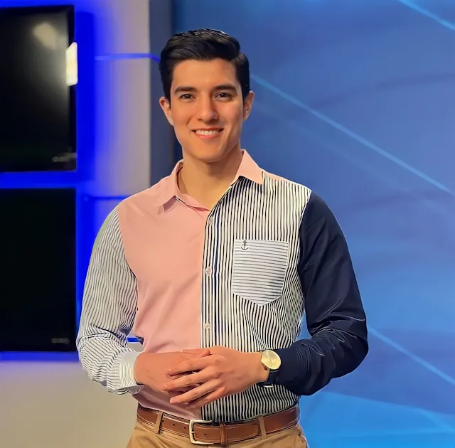 Well-dressed man with a wristwatch smiling