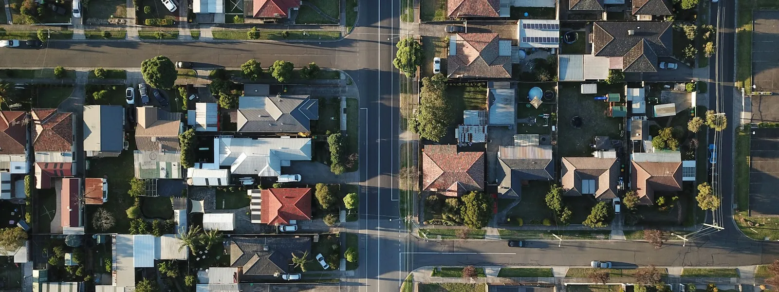 Residential condominium with multiple houses seen from above on a sunny day