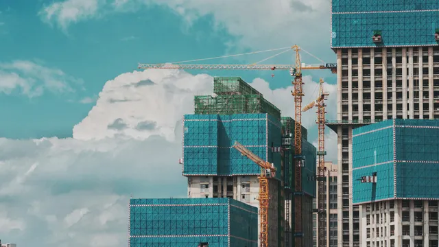 Buildings under construction with cranes