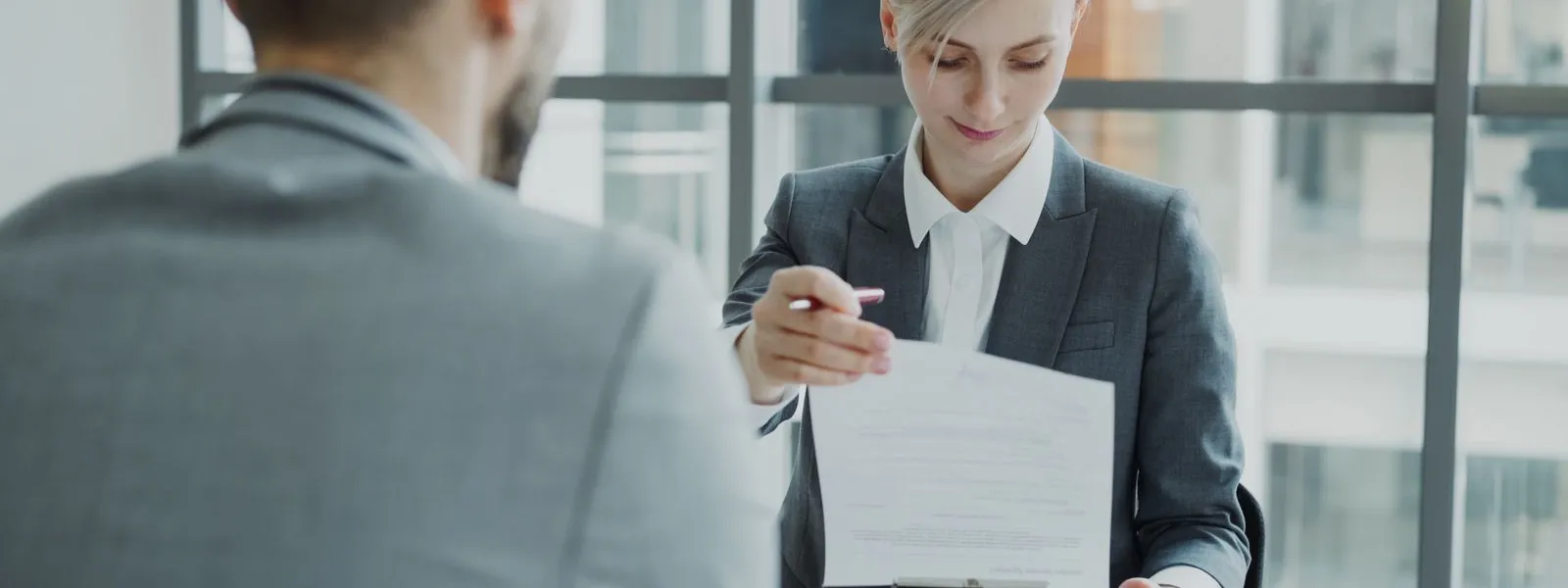 Business meeting with a contract review at an office table